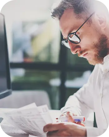 A senior accountant analyzing his taxes to file for tax returns.